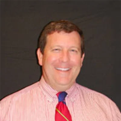 Orthodontist Thomas F Mooney Smiling In Dress Shirt